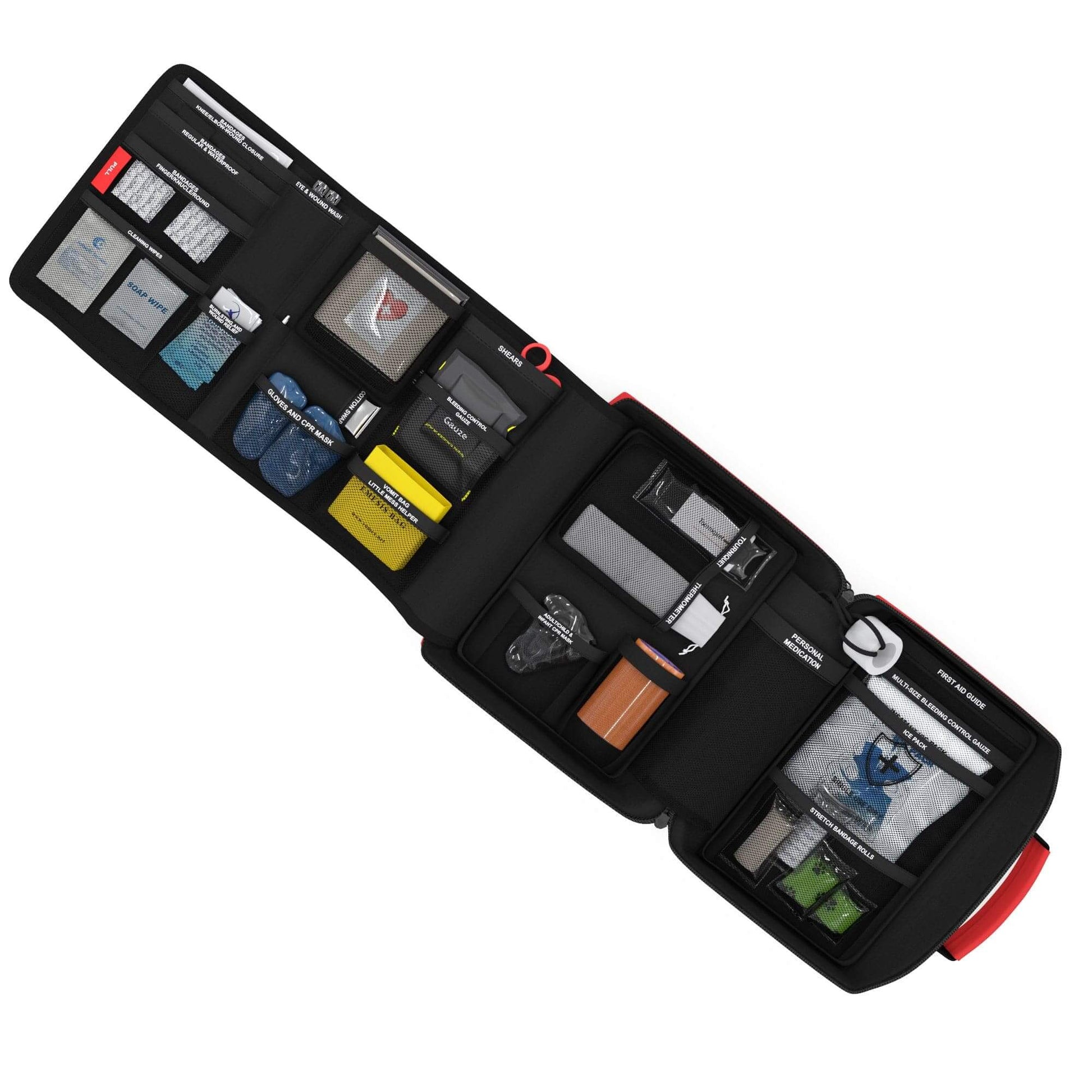 Fully opened Family first aid kit with black background. with various compartments on a white background and labeled to easily find medical and first aid supplies for adults and children. 