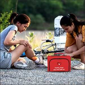 Family First Aid Kit helping a child who was injured while riding a bicycle. High quality medical supplies by The Life Safety Pro