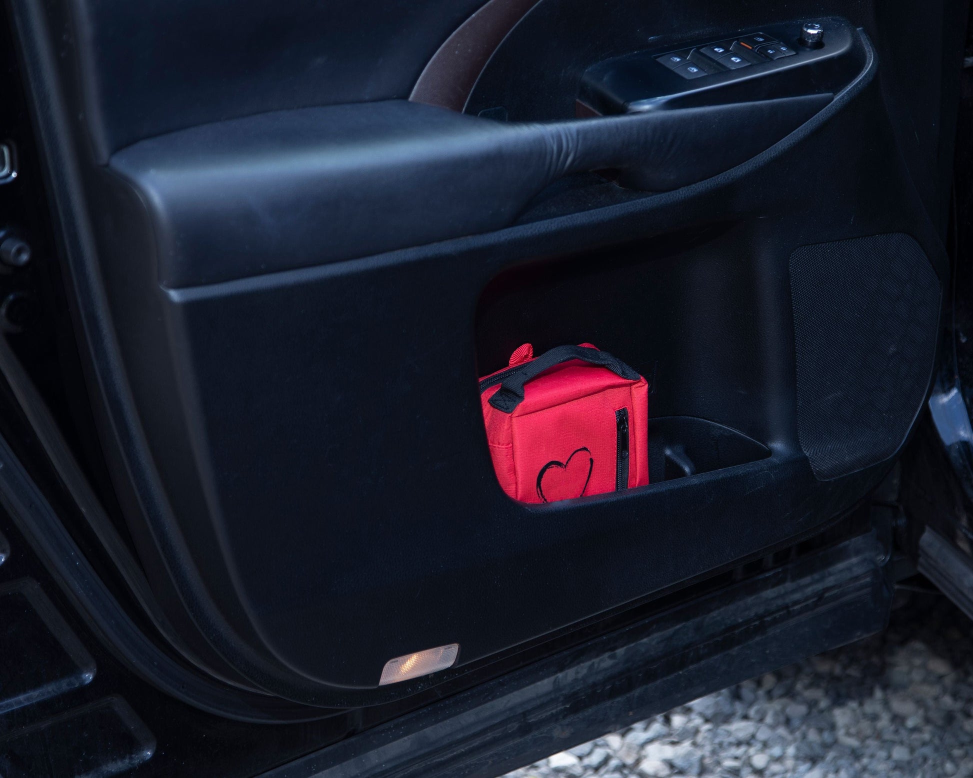 Life Safety Pro Childrens First Aid and CPR kit in the door of a vehicle