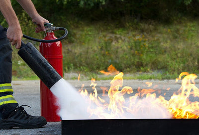 Hands-on fire extinguisher training on a live fire